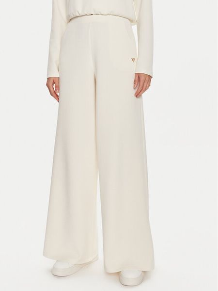 Guess Spodnie dresowe Olympe V4YB07 KCAY2 Beżowy Relaxed Fit. Brązowe spodnie dresowe Guess, m, z aplikacjami, z dresówki. Za 354,99 zł.