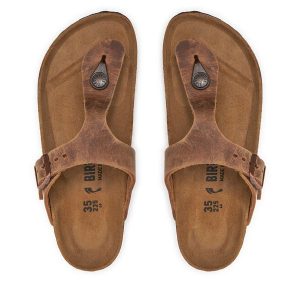 Japonki Birkenstock. Brązowe klapki Birkenstock, bez wzorów, bez obcasa. Za 485,99 zł.