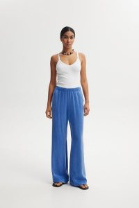 SPODNIE LEXI NIEBIESKIE XL - Flawless. Niebieskie spodnie z wysokim stanem Flawless, bez wzorów, z materiału, z podwyższonym stanem. Za 449,00 zł.