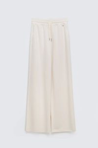 Spodnie damskie dresowe z szeroką nogawką kremowe Lunarap 102. Białe spodnie dresowe Big Star, l, bez wzorów, z dresówki. Za 179,99 zł.