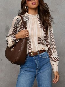 LA Angels Bluzka w kolorze biało-brązowym rozmiar: M. Białe bluzki LA Angels, m, bez wzorów, bez kołnierzyka, bez ramiączek. Za 191,42 zł.