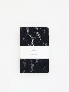 Wzorzyste legginsy - czarny. Czarne legginsy Reserved, bez wzorów, z dzianiny. Za 69,99 zł.