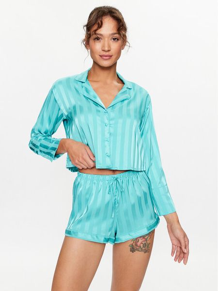 Hunkemöller Koszulka piżamowa 203163 Niebieski Comfortable Fit. Niebieskie koszule nocne Hunkemöller, bez wzorów, z syntetyku, bez ramiączek. Za 89,99 zł.