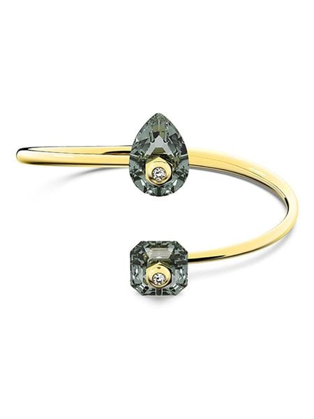 Swarovski Pozłacana bransoletka z elementami ozdobnymi rozmiar: M. Szare bransoletki Swarovski, z kryształem, metalowe. Za 257,31 zł.