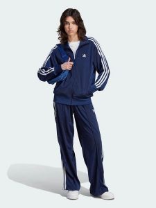 Adidas Spodnie dresowe "Firebird" w kolorze granatowym rozmiar: L. Niebieskie spodnie dresowe ADIDAS, l, bez wzorów, z dresówki. Za 146,95 zł.
