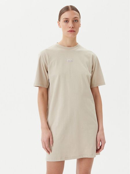Calvin Klein Jeans Sukienka codzienna J20J225289 Beżowy Relaxed Fit. Brązowe kombinezony Calvin Klein Jeans, s, bez wzorów, z bawełny, bez kołnierzyka, bez ramiączek. Za 159,99 zł.