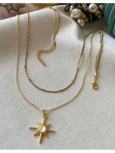 Luseera Pozłacany naszyjnik z zawieszką - dł. 55 cm rozmiar: onesize. Białe naszyjniki Luseera, z perłą, pozłacane. Za 38,45 zł.