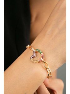 Heliophilia Pozłacana bransoletka z elementem ozdobnym rozmiar: onesize. Żółte bransoletki Heliophilia, z cyrkonią, metalowe. Za 30,99 zł.