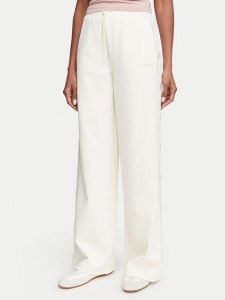 Guess Spodnie dresowe V5BB12 KCX22 Kremowy Regular Fit. Białe spodnie dresowe Guess, m, z aplikacjami, z dresówki. Za 474,99 zł.