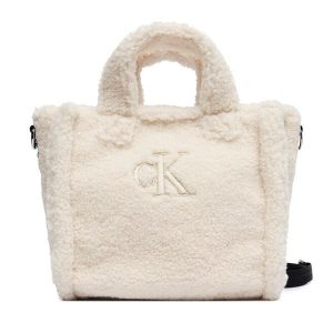 Torebka Calvin Klein Jeans. Brązowe shopper bag Calvin Klein Jeans, bez wzorów, z jeansu, bez dodatków. Za 209,99 zł.