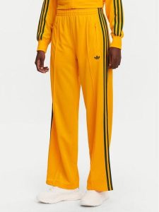 Adidas Spodnie dresowe adicolor Classic Firebird JP2316 Żółty Loose Fit. Żółte spodnie dresowe ADIDAS, s, bez wzorów, z dresówki. Za 199,99 zł.