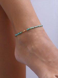 Luja Bijoux Pozłacana bransoletka z kryształami na kostkę rozmiar: onesize. Niebieskie bransoletki Luja Bijoux, z kryształem, pozłacane. Za 61,45 zł.