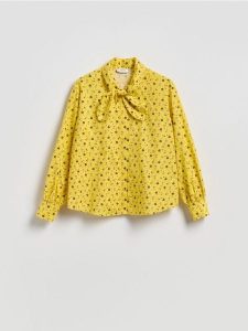 Koszula z kwiatowym motywem - żółty. Żółte koszule Reserved, l, bez wzorów, z bawełny, bez kołnierzyka, bez ramiączek. Za 129,99 zł.