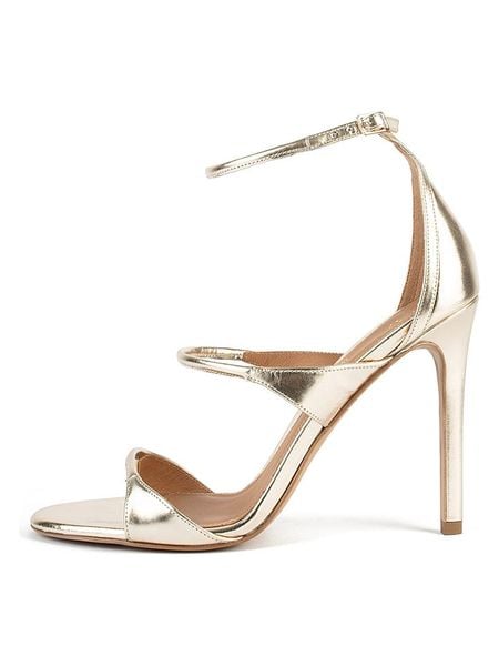 Loft37 Skórzane sandały w kolorze złotym rozmiar: 35. Żółte sandały Loft37, bez wzorów, z otwartym noskiem, bez obcasa, na koturnie, bez zapięcia. Za 382,99 zł.