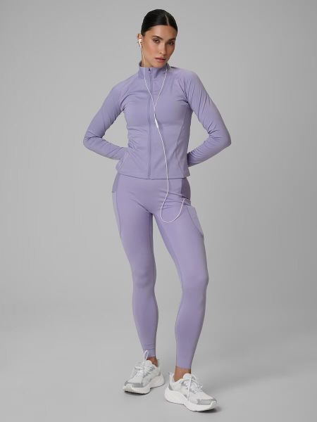 Legginsy treningowe szybkoschnące damskie z kieszeniami. Fioletowe legginsy 4f, bez wzorów, z dzianiny, z podwyższonym stanem, długie. Za 179,99 zł.
