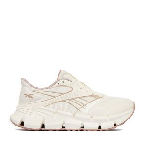 Buty do biegania Reebok. Białe buty sportowe Reebok, bez wzorów, bez zapięcia, do biegania. Za 489,99 zł.