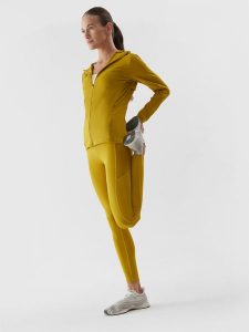 4F Legginsy do biegania szybkoschnące damskie L. Żółte legginsy 4f, bez wzorów, z podwyższonym stanem. Za 249,99 zł.