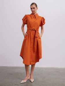 BGN Sukienka w kolorze pomarańczowym rozmiar: 38. Pomarańczowe sukienki BGN, na imprezę, bez wzorów, z tkaniny, bez kołnierzyka, bez ramiączek, maxi. Za 136,13 zł.