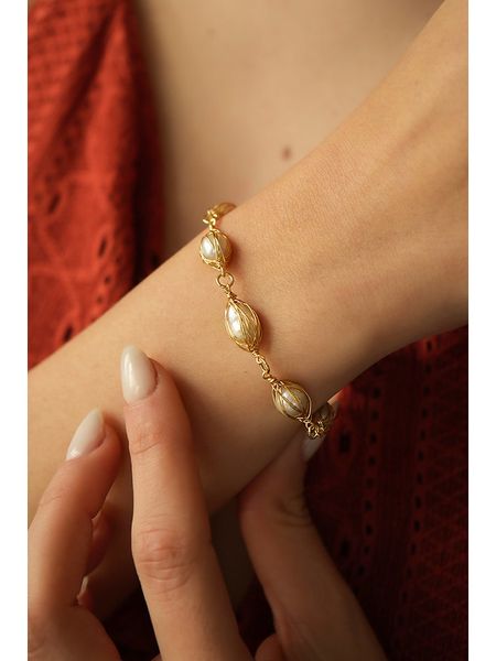 Pierres delicates Bransoletka w kolorze jasnoróżowym z perłami rozmiar: onesize. Różowe bransoletki Pierres delicates, z perłą, z mosiądzu. Za 43,99 zł.