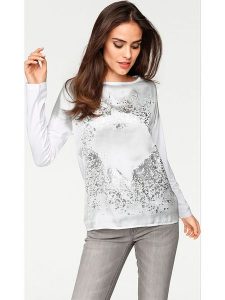 Heine Koszulka w kolorze białym rozmiar: 42. Białe bluzki Heine, bez wzorów, bez kołnierzyka, bez ramiączek. Za 69,75 zł.