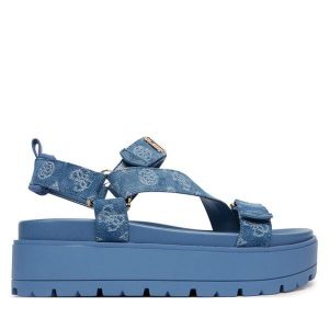 Sandały Guess. Niebieskie sandały Guess, z aplikacjami, bez obcasa, na płaskiej podeszwie, bez zapięcia. Za 559,99 zł.