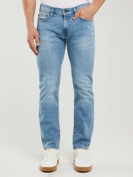 Jeansy męskie dopasowane z przetarciami jasnoniebieskie Tobias 295. Niebieskie rurki Big Star, z denimu. Za 299,99 zł.