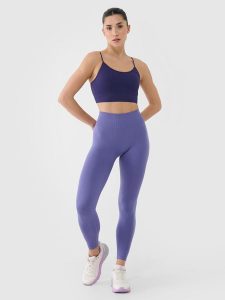 4F Legginsy treningowe bezszwowe damskie - granatowe XS/S. Niebieskie legginsy 4f, bez wzorów, z dzianiny, z podwyższonym stanem. W wyprzedaży za 79,99 zł.