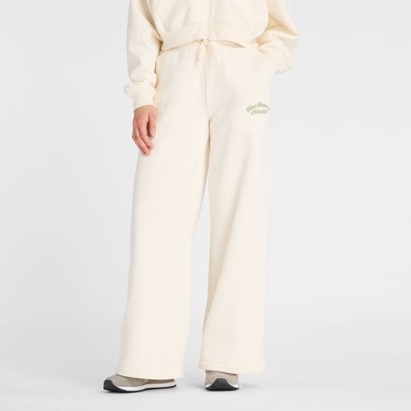 Spodnie damskie New Balance WP53902PEF – beżowe. Brązowe spodnie z wysokim stanem New Balance, z aplikacjami, z bawełny, z podwyższonym stanem. Za 199,99 zł.