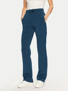 Guess Spodnie dresowe V3RB21 K7UW2 Niebieski Regular Fit. Niebieskie spodnie dresowe Guess, s, z aplikacjami, z dresówki. Za 229,99 zł.
