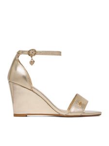 MEXX Sandały EO-CC2549-01 Złoty. Żółte sandały Mexx, bez wzorów, ze skóry, bez obcasa, na koturnie, bez zapięcia. Za 299,99 zł.