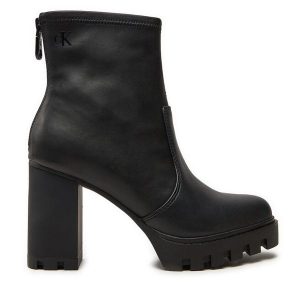 Botki Calvin Klein. Czarne botki Calvin Klein, bez wzorów, bez obcasa, na słupku, bez zapięcia. Za 399,99 zł.
