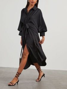 Milan Kiss Sukienka koszulowa w kolorze czarnym rozmiar: XL. Czarne sukienki Milan Kiss, na co dzień, xl, bez wzorów, bez kołnierzyka, bez ramiączek, maxi, koszulowe. Za 184,89 zł.