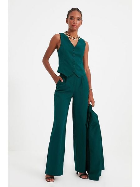 Trendyol Spodnie w kolorze morskim rozmiar: 40. Niebieskie spodnie z wysokim stanem Trendyol, bez wzorów, z materiału, z podwyższonym stanem. Za 61,75 zł.