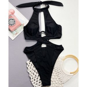 Strój kąpielowy z wycięciami na plażę i basen Majram. Czarne stroje jednoczęściowe Intica, bez wzorów. Za 149,00 zł.