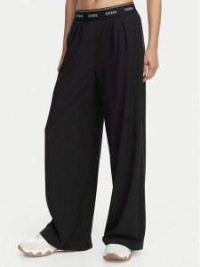 Guess Spodnie dresowe V6GB08 W1771 Czarny Relaxed Fit. Czarne spodnie dresowe Guess, m, z aplikacjami, z dresówki. Za 344,99 zł.