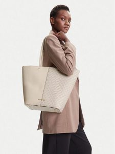 MICHAEL Michael Kors Torebka Flora 30T5GFFT3B Kremowy. Białe shopper bag MICHAEL Michael Kors, bez wzorów, ze skóry, bez dodatków. Za 795,99 zł.