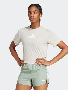 Adidas Koszulka w kolorze kremowym rozmiar: L. Brązowe bluzki ADIDAS, l, bez wzorów, bez kołnierzyka, bez ramiączek. Za 83,42 zł.