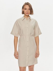 Calvin Klein Sukienka koszulowa K20K206697 Beżowy Relaxed Fit. Brązowe kombinezony Calvin Klein, bez wzorów, ze lnu, bez kołnierzyka, bez ramiączek. Za 479,99 zł.