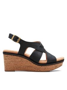 Clarks Skórzane sandały "Elleri Rae" w kolorze czarnym na koturnie rozmiar: 41,5. Czarne sandały Clarks, bez wzorów, z nubiku, z otwartym noskiem, bez obcasa, na koturnie, bez zapięcia. Za 162,49 zł.