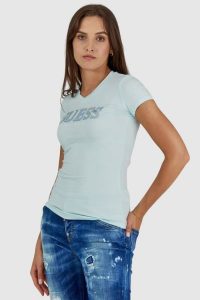 GUESS Błękitny t-shirt damski z metalicznym logo i cyrkoniami. Niebieskie t-shirty Guess, s, z aplikacjami, z bawełny, bez kołnierzyka, bez ramiączek. W wyprzedaży za 129,99 zł.
