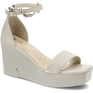 Beżowe Sandały Carinii Eleganckie Skórzane Buty. Brązowe sandały Carinii, bez wzorów, ze skóry, bez obcasa, na koturnie, bez zapięcia. Za 245,00 zł.