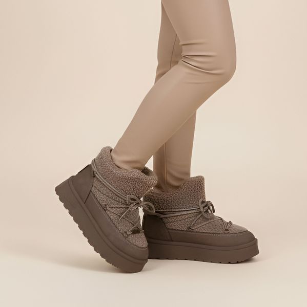 Śniegowce damskie Big Star, ocieplane futerkiem na grubej platformie z okrągłym noskiem, brązowe, SS274112. Brązowe buty zimowe Big Star, z okrągłym noskiem, bez obcasa, bez zapięcia. Za 143,90 zł.