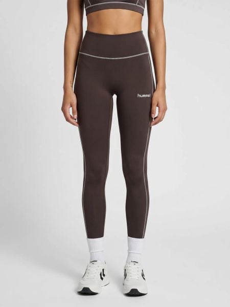 Damskie legginsy Hummel Pulse Retro. Brązowe legginsy Hummel, bez wzorów, z materiału. Za 191,42 zł.