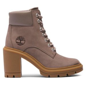 Trzewiki Timberland. Brązowe botki Timberland, bez wzorów, bez obcasa, na słupku, bez zapięcia. Za 479,99 zł.