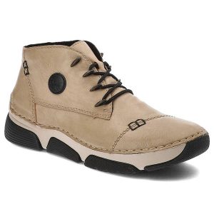 Beżowe Botki Rieker Damskie Eleganckie Obuwie Na Jesień. Brązowe botki Rieker, na jesień, bez wzorów, z syntetyku, bez obcasa, bez zapięcia. Za 288,99 zł.