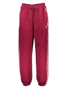 Adidas Spodnie dresowe w kolorze czerwonym rozmiar: 34. Czerwone spodnie dresowe ADIDAS, bez wzorów, z dresówki. Za 100,99 zł.