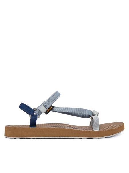 Teva Sandały Original Universal Slim 1150110 Niebieski. Niebieskie sandały Teva, bez wzorów, z materiału, bez obcasa, na płaskiej podeszwie, bez zapięcia. Za 201,99 zł.
