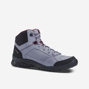 Buty turystyczne damskie Quechua NH100 mid. Brązowe buty trekkingowe QUECHUA, z syntetyku, przed kolano, bez zapięcia. Za 89,99 zł.
