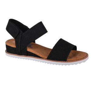 Sandały Skechers Model Desert Kiss Kolor Czarny. Czarne sandały Skechers, bez wzorów, z tkaniny, bez obcasa, bez zapięcia. Za 199,99 zł.