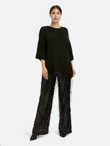 Milano Italy Spodnie w kolorze czarnym z cekinami rozmiar: 34. Czarne spodnie z wysokim stanem Milano Italy, bez wzorów, z materiału, z podwyższonym stanem. Za 252,99 zł.